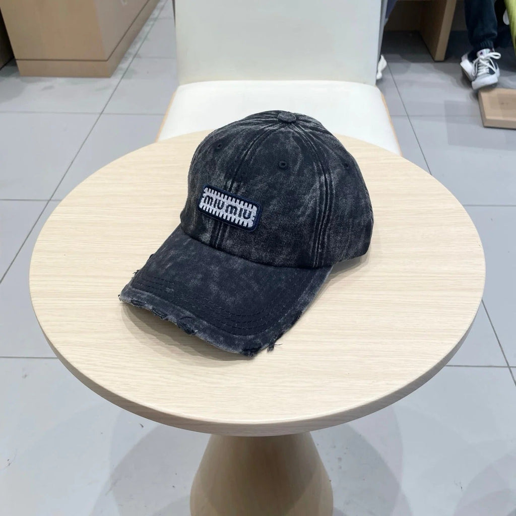 MM DISTRESSED FABRIC BASEBALL CAP IN BLACK WITH EMBROIDERED LOGO